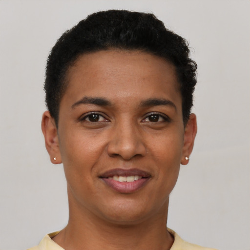 Joyful latino young-adult female with short  brown hair and brown eyes