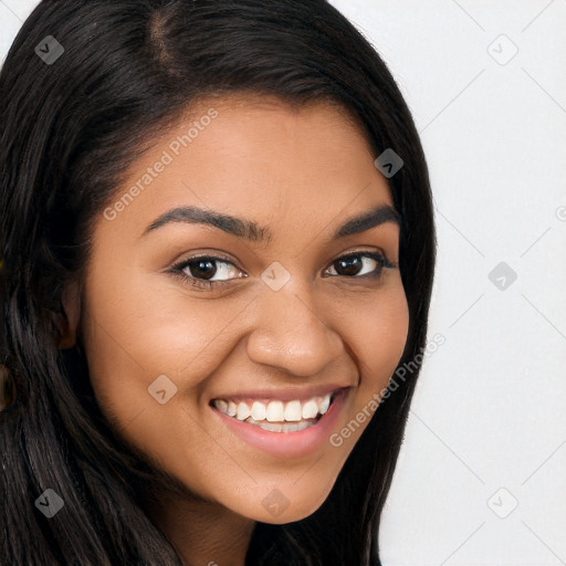 Joyful latino young-adult female with long  brown hair and brown eyes