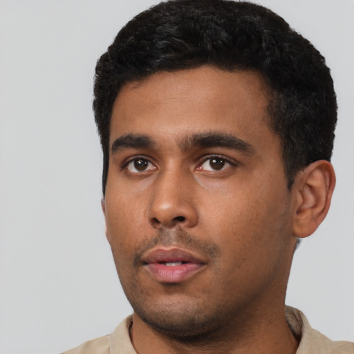 Neutral latino young-adult male with short  black hair and brown eyes