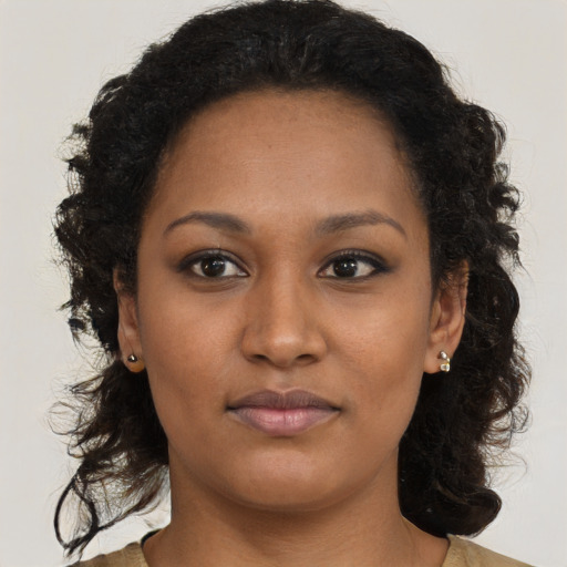 Neutral black young-adult female with long  brown hair and brown eyes