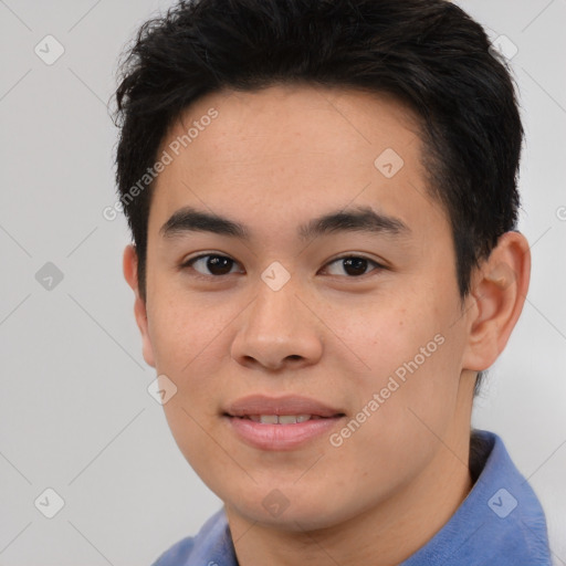 Joyful asian young-adult male with short  brown hair and brown eyes