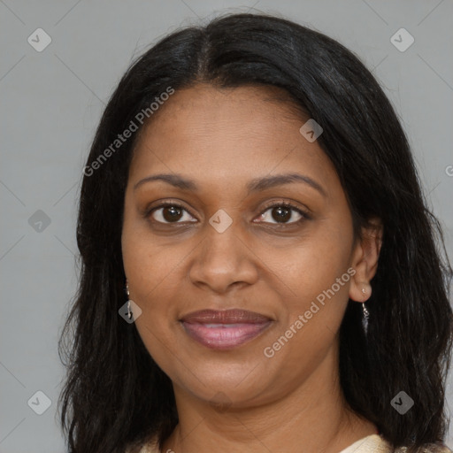 Joyful black adult female with medium  brown hair and brown eyes