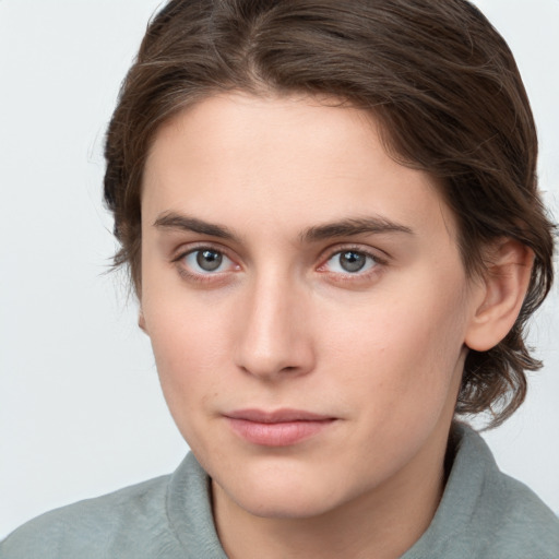 Neutral white young-adult female with medium  brown hair and brown eyes