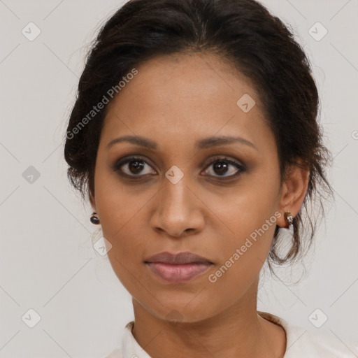 Joyful black young-adult female with medium  brown hair and brown eyes