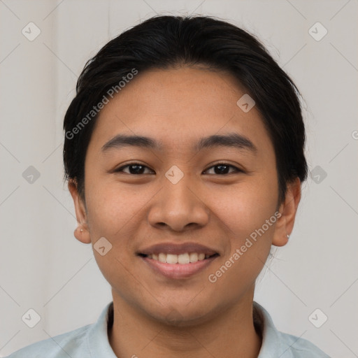 Joyful latino young-adult female with short  black hair and brown eyes