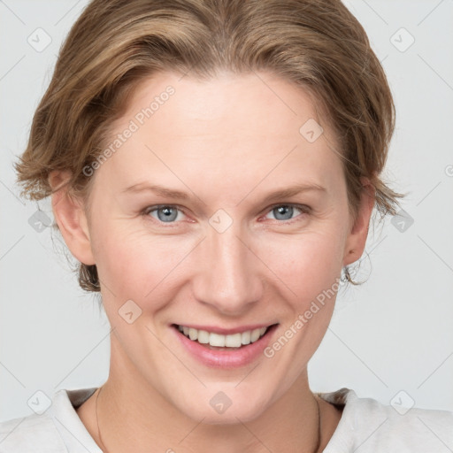 Joyful white young-adult female with medium  brown hair and grey eyes