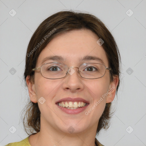 Joyful white young-adult female with medium  brown hair and green eyes