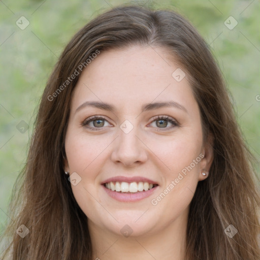 Joyful white young-adult female with long  brown hair and green eyes