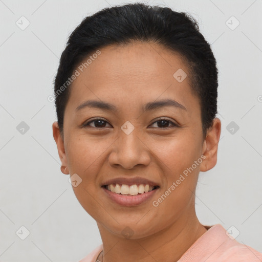 Joyful latino young-adult female with short  brown hair and brown eyes