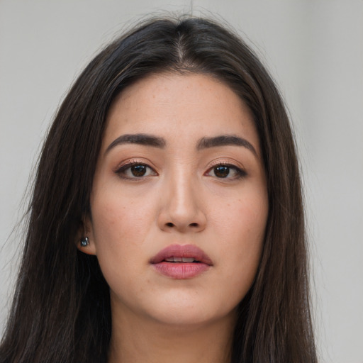 Neutral asian young-adult female with long  brown hair and brown eyes
