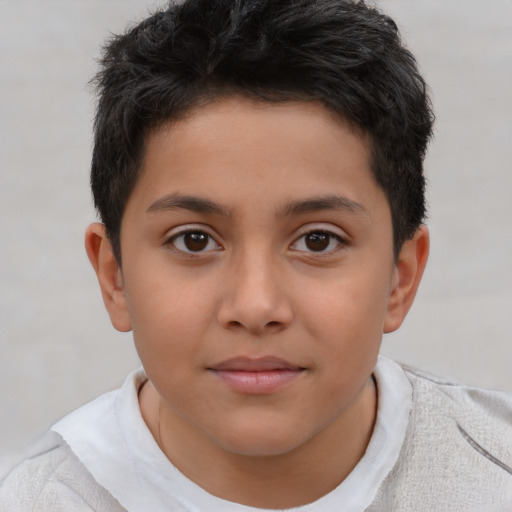 Joyful white child male with short  brown hair and brown eyes