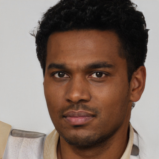 Neutral black young-adult male with short  black hair and brown eyes