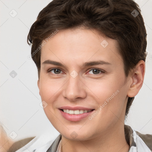 Joyful white young-adult female with short  brown hair and brown eyes