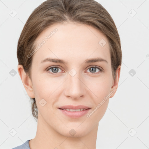 Joyful white young-adult female with short  brown hair and grey eyes