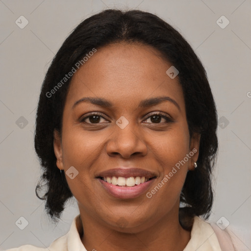 Joyful black young-adult female with medium  brown hair and brown eyes