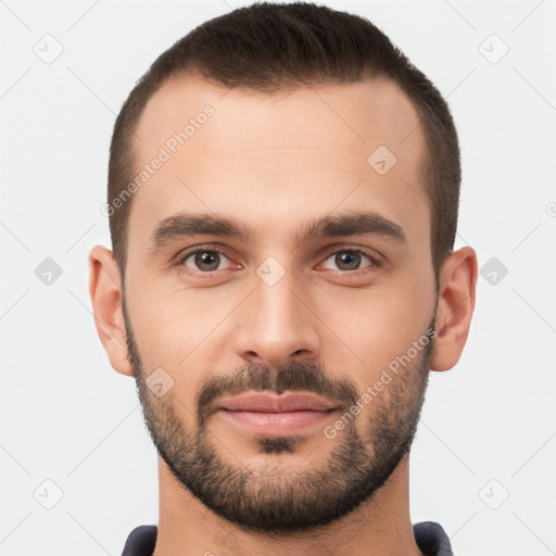 Joyful white young-adult male with short  brown hair and brown eyes