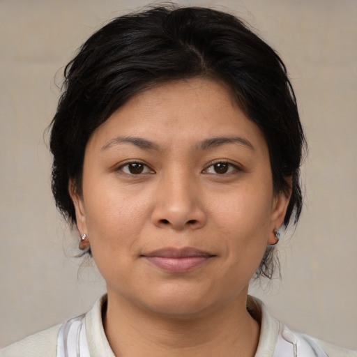 Joyful asian young-adult female with medium  brown hair and brown eyes