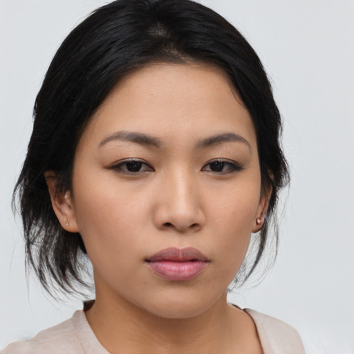 Neutral asian young-adult female with medium  brown hair and brown eyes