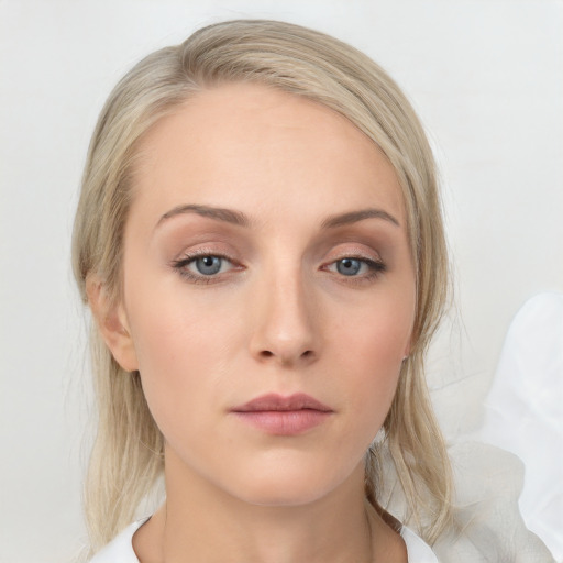 Neutral white young-adult female with medium  brown hair and blue eyes