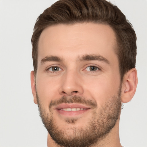 Joyful white young-adult male with short  brown hair and brown eyes