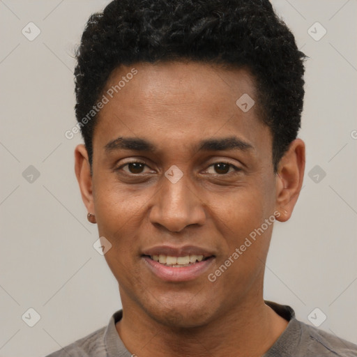 Joyful black young-adult male with short  black hair and brown eyes