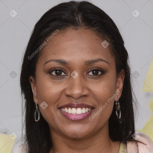 Joyful black young-adult female with long  brown hair and brown eyes