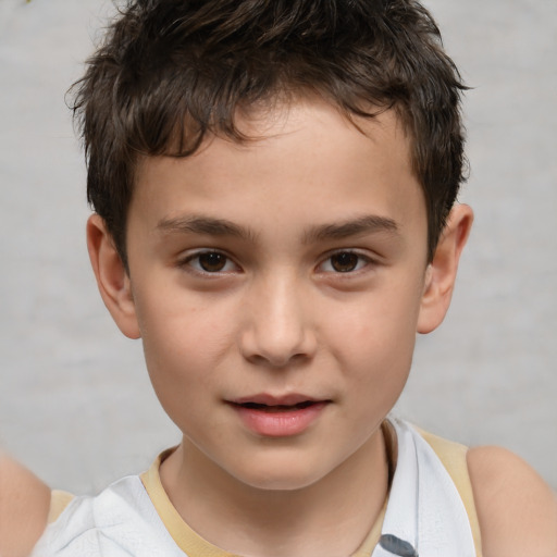 Joyful white child male with short  brown hair and brown eyes