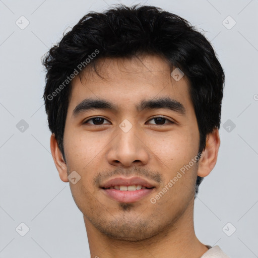 Joyful asian young-adult male with short  black hair and brown eyes