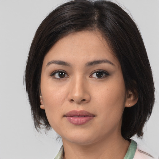 Neutral asian young-adult female with medium  brown hair and brown eyes