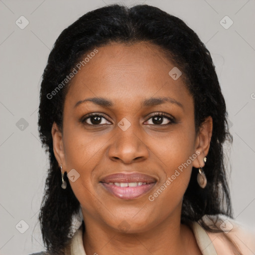 Joyful latino adult female with medium  brown hair and brown eyes