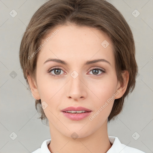 Joyful white young-adult female with medium  brown hair and green eyes