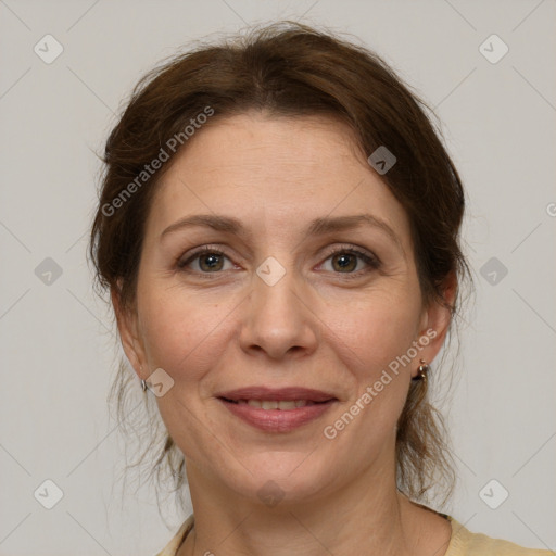 Joyful white adult female with medium  brown hair and grey eyes