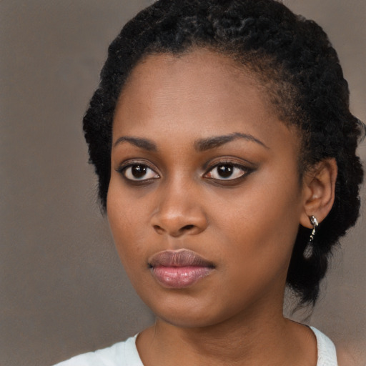 Neutral black young-adult female with medium  black hair and brown eyes
