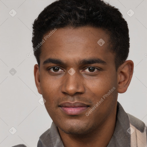 Joyful black young-adult male with short  brown hair and brown eyes