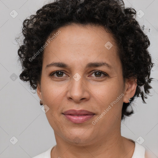 Joyful white adult female with short  brown hair and brown eyes