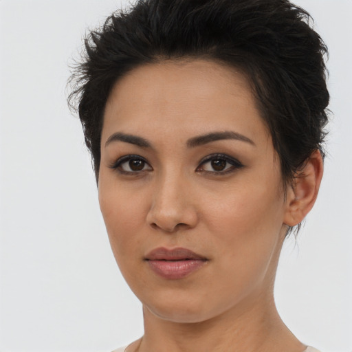 Joyful latino young-adult female with short  brown hair and brown eyes