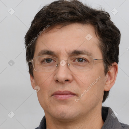 Joyful white adult male with short  brown hair and grey eyes