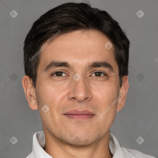 Joyful white adult male with short  brown hair and brown eyes