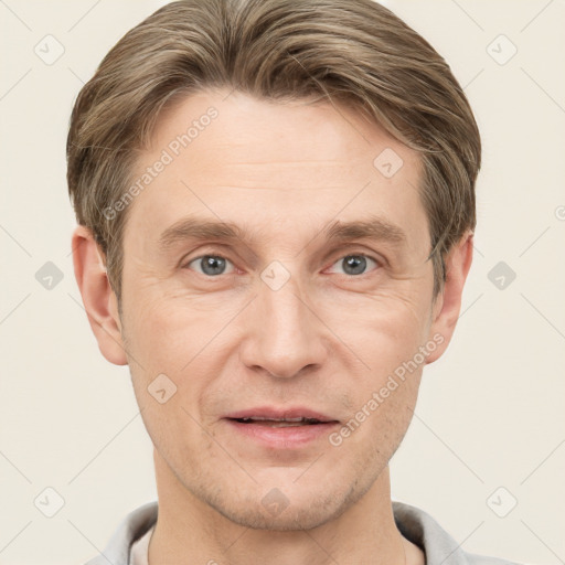 Joyful white adult male with short  brown hair and grey eyes