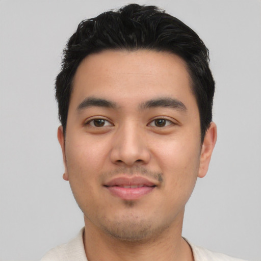Joyful asian young-adult male with short  black hair and brown eyes