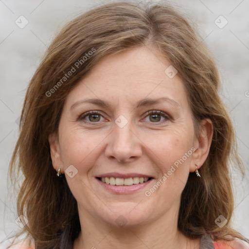 Joyful white adult female with medium  brown hair and grey eyes