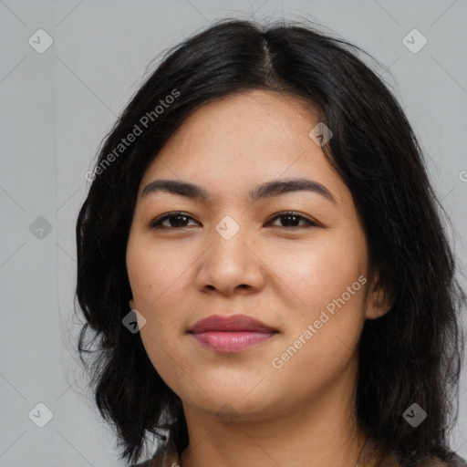 Joyful asian young-adult female with long  black hair and brown eyes