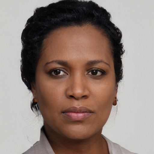 Neutral black young-adult female with short  black hair and brown eyes