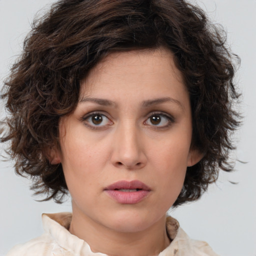 Neutral white young-adult female with medium  brown hair and brown eyes
