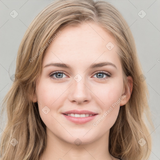 Joyful white young-adult female with long  brown hair and blue eyes