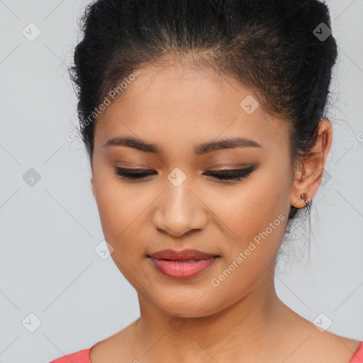 Joyful latino young-adult female with medium  brown hair and brown eyes