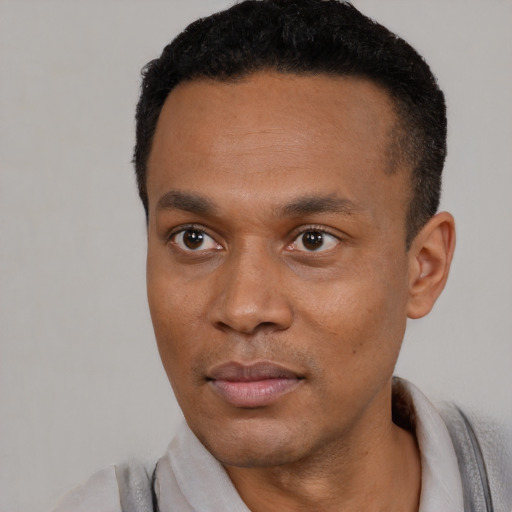 Neutral black young-adult male with short  black hair and brown eyes