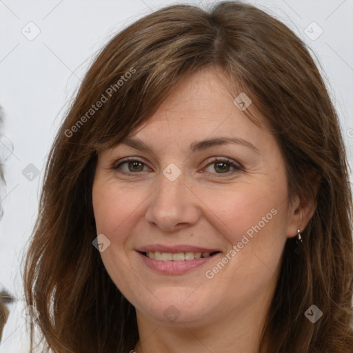 Joyful white adult female with long  brown hair and brown eyes