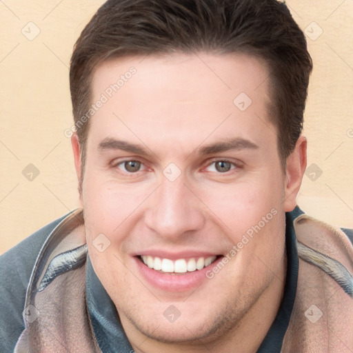 Joyful white young-adult male with short  brown hair and brown eyes