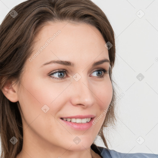 Joyful white young-adult female with long  brown hair and blue eyes